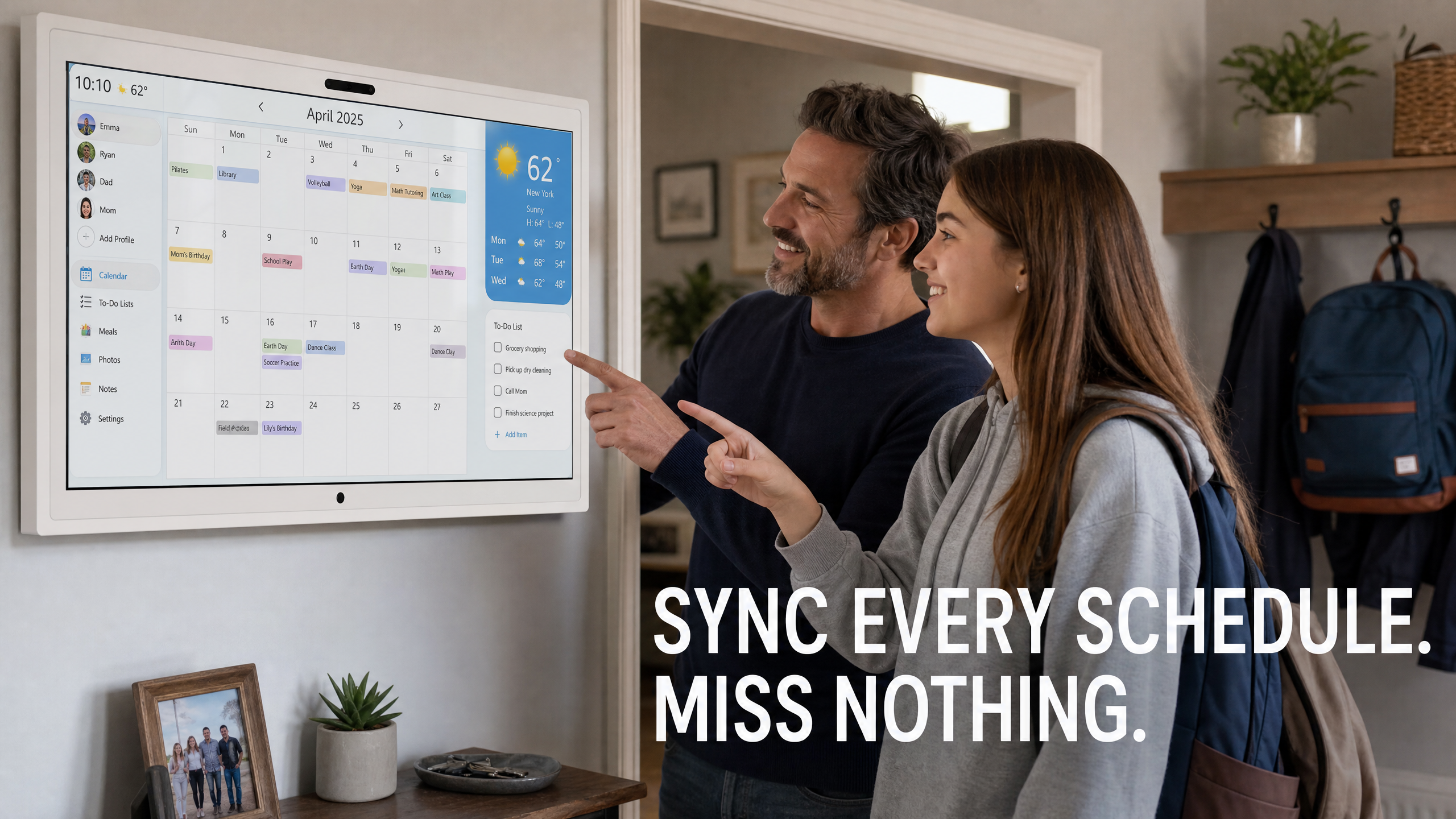 Family looking at Meswao 21.5 inch digital calendar on kitchen wall